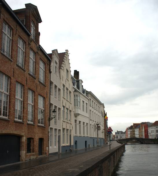 istock Cobblestone path along Zwyn River Bruges Belgium 2196090218