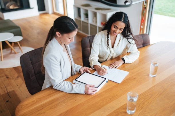 istock Financial Advisor Meeting with Client at Home 2196090318