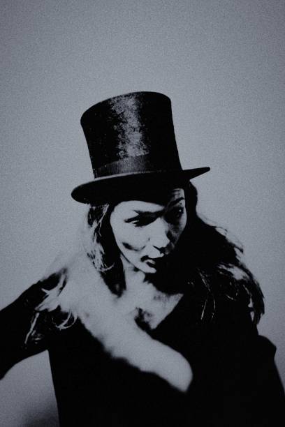 istock The woman with the top hat. 2196092477