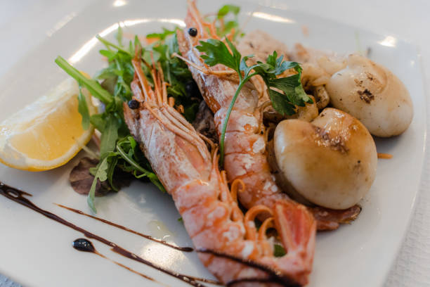 istock Seafood. Cooked shrimps on a plate. Close-up. 2196093703