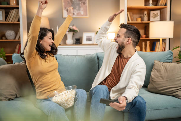 istock Playful couple bonding over mobile games 2196096981