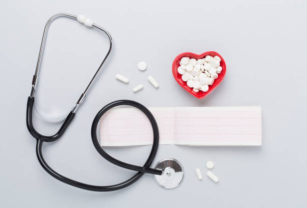 istock Stethoscope with heart medicines on color background, top view 2196099904