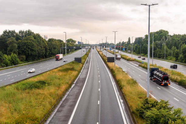 View of a motorway under cloudy sky at sunset