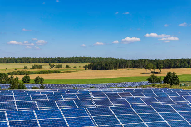 istock modern solar panels in a rural landscape 2196103098