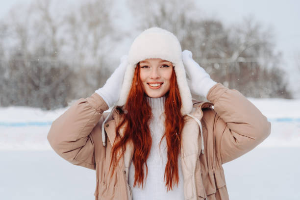 istock young redhead girl in ice rink 2196105469
