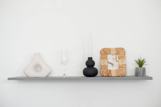 istock Elegant interior shelf display with minimalistic decor items and greenery 2196106668