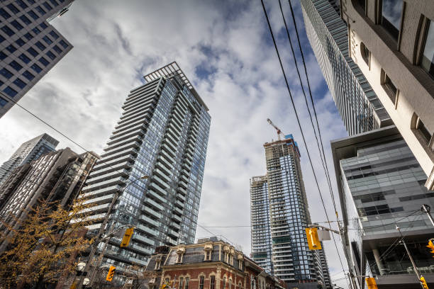 In downtown Toronto, soaring skyscrapers define a thriving Central Business District. This North American hub exemplifies economic dynamism, as corporate offices house diverse sectors spanning finance, technology, and professional services. Such vertical expansion indicates robust investment, supporting employment, trade, and innovation. The modern skyline, framed by intricate infrastructure, signifies a city evolving to meet global demands. In this interplay of glass and steel, business interests converge, forging prosperity, cultural exchange, and a forward-looking urban identity.