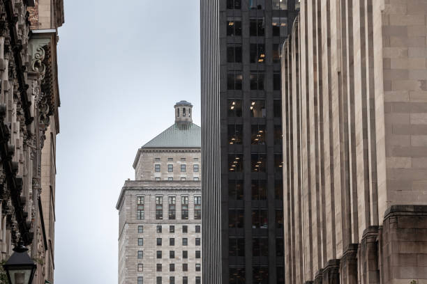 istock At dusk, skyscrapers and older buildings blend in Old Montreals evolving skyline, reflecting a historic urban core adapting to modern growth, typical from Canada, USA and North America. 2196108049