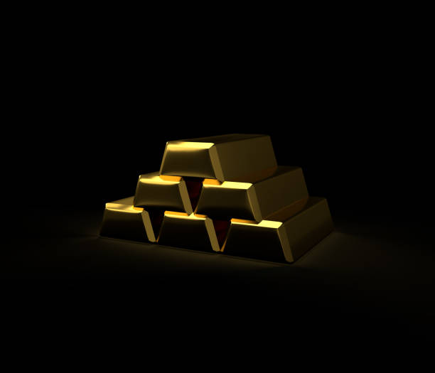 Gold bars stacked on a dark background create a powerful image of wealth, investment, and financial security