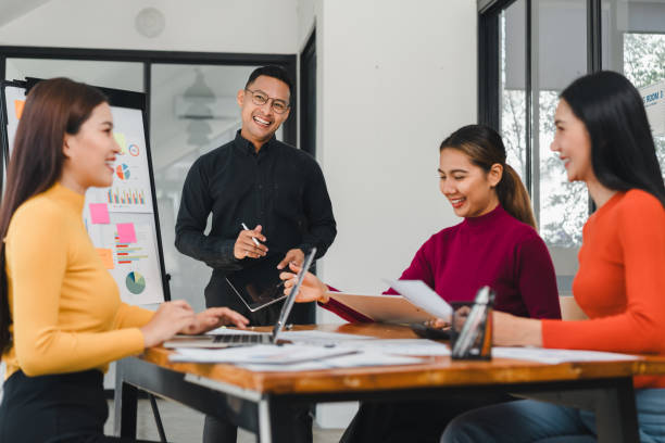 istock Collaborative meeting with diverse professionals discussing ideas and strategies. atmosphere is positive and engaging, showcasing teamwork and creativity 2196110330