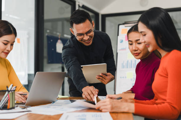istock Collaborative business meeting with diverse professionals discussing data analysis and strategies. Engaged teamwork fosters creativity and productivity in modern office 2196110679