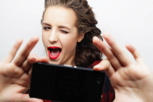 istock Pretty hipster girl taking selfie. 2196112588