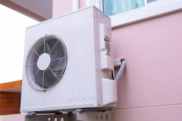 istock External split wall air conditioner compressor unit  installed on the outside of the building. 2196116680