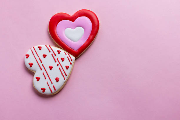istock Handmade heart-shaped cookie with red, pink and white colors. 2196120120