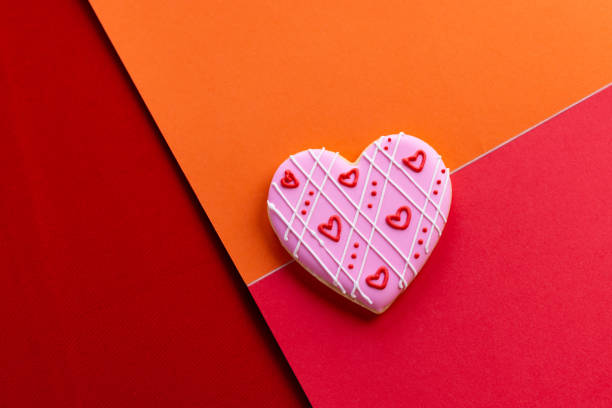istock Handmade heart-shaped cookie with red, pink and white colors. 2196120176