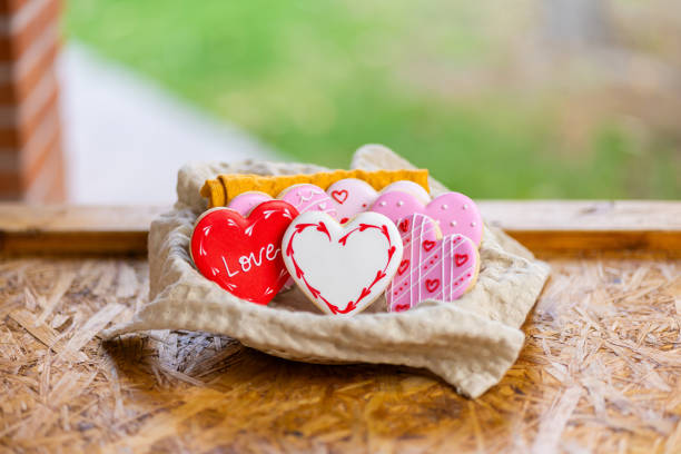 Valentines day heart shaped shortbread cookie with a cup of tea