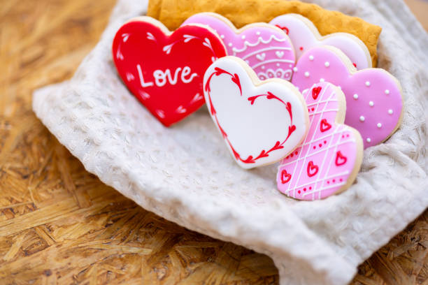 istock Handmade heart-shaped cookie with red, pink and white colors. 2196120321