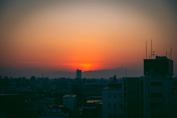 The setting sun sinking into a residential area of Tokyo.