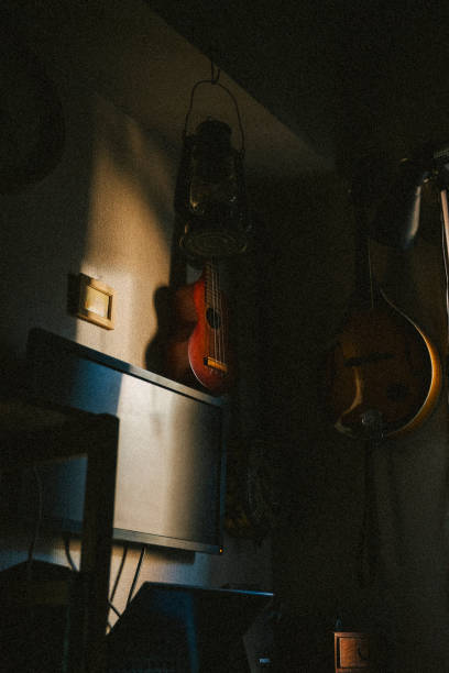 istock The setting sun shines on the musician's desk. 2196120782