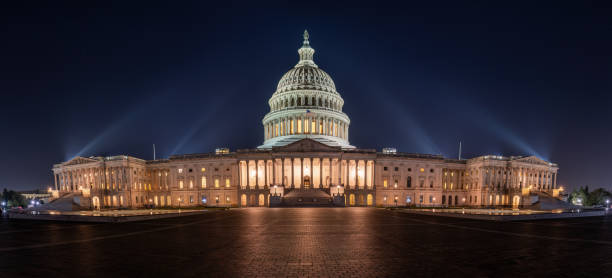 istock Panorama of the illuminated U.S. Capitol Building 2196129022