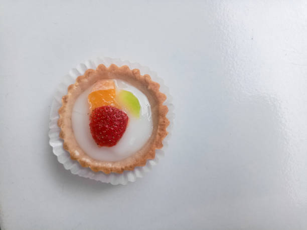 Small fruit pia cake on a white background. Kue Pia Buah.
