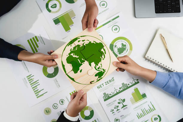istock Green business corporate put jigsaw together for sustainable environment development goal. Group of volunteers help solve environmental problem together to net zero. World environment day, ESG concept 2196131300