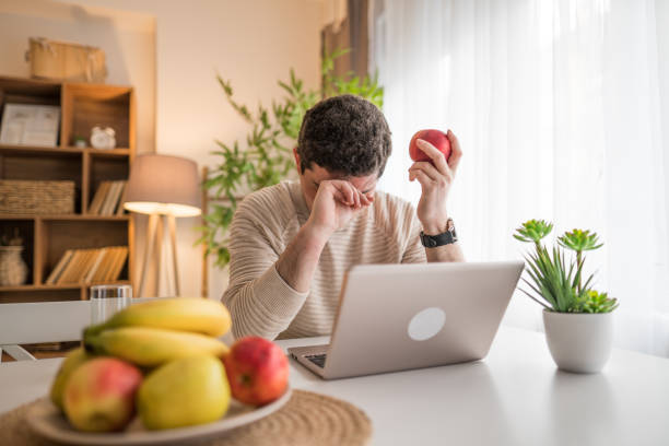 istock A man tired of work, work online at home 2196132720