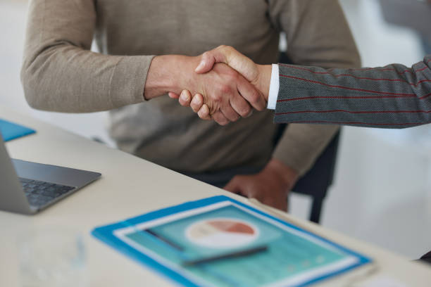 istock Reaching a successful deal in the office! 2196136109