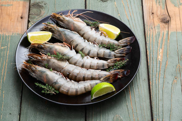 istock Raw big tiger ( king ) shrimps photography . Top view 2196137933