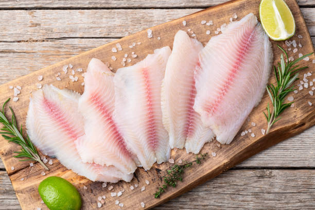 istock Raw tilapia fillet photography . Top view 2196137939