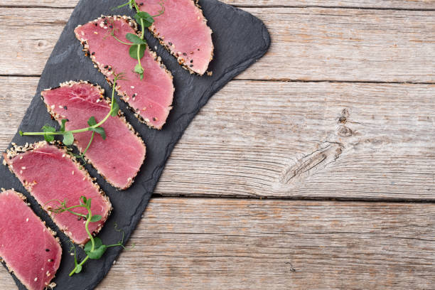 istock Sliced tuna steak with sesame photography . Top view 2196137971