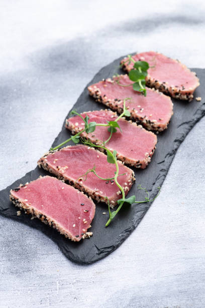 istock Sliced tuna steak with sesame photography . Top view 2196137976