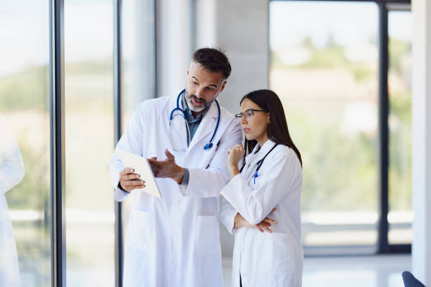 istock Medical experts working on touchpad in a hospital. 2196138274