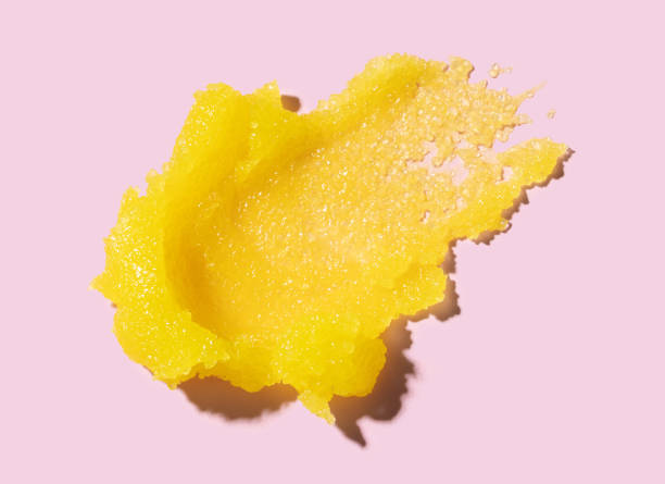 istock scrub cream texture on pink background skin care concept 2196139360