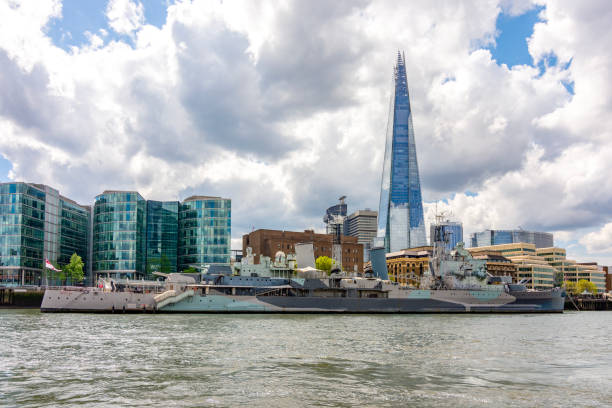 istock Shard skyscraper and Belfast battleship on Thames river, London, UK 2196141936