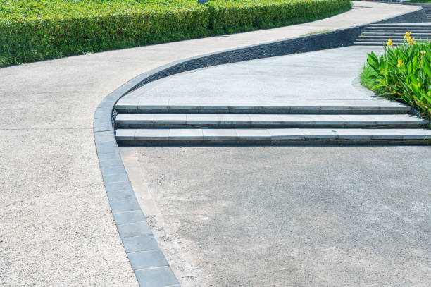 istock Curved pathway and stairs beside flowerbed 2196142133