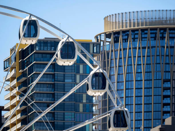 A Ferris wheel alongside apartment buildings at background. Melbourne, Australia