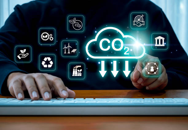 istock CO2 emissions limit climate change, carbon dioxide reduction, energy conservation sustainable concept. CO2 reduction icon and alternative energy sources on virtual screen operated by businessman. 2196143315