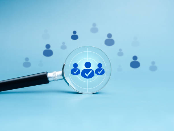 istock Business digital marketing, target audience and customer, HR human resources, teamwork management concepts. People group icon, hit target in magnifying glass lens on blue background, minimal style. 2196143380
