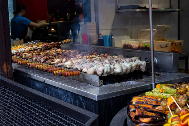 istock Meat on skewers is grilled. Light smoke from the meat. 2196143406