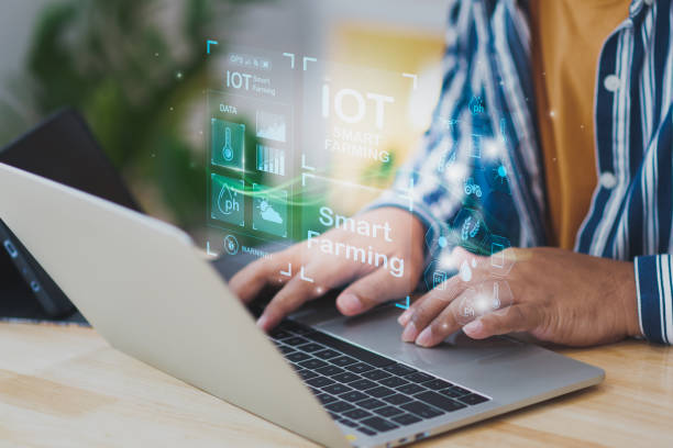 istock Businessman Young Smart farmer using smart computer, directive track control agriculture Farm, icon futuristic AI data, Control agricultural production technology industry system and trading orders. 2196143716
