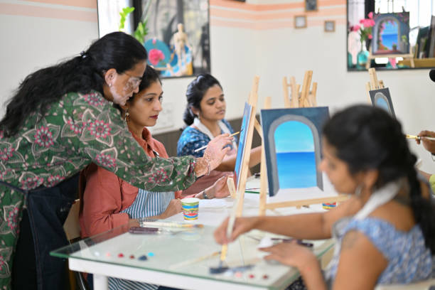 istock Skilled artisan passionately teaching canvas painting in a creative studio 2196144361