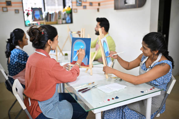 istock Participants immersed in canvas painting during a workshop in an art studio 2196144383