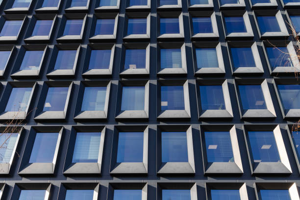 istock Modern building facade with large glass windows. Business office background 2196144471