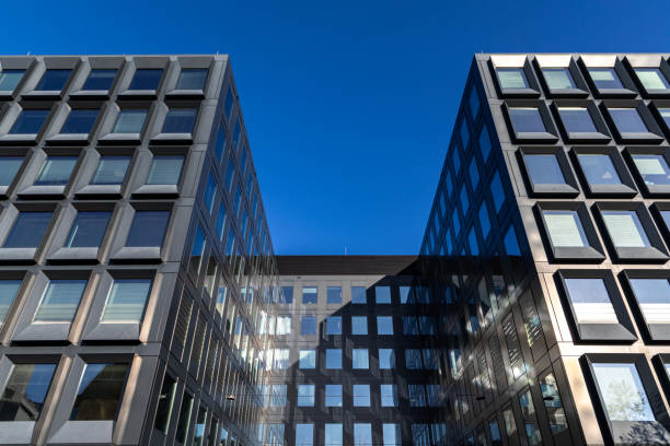 istock Modern building facade with large glass windows. Business office background 2196144476