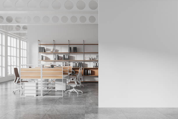istock Modern open space office interior with shelves, desks, and chairs in a spacious loft-style room with large windows and gray flooring. 3D Rendering 2196144618