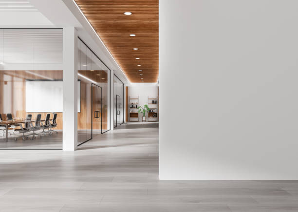 istock Modern hallway with blank wall and office interiors featuring glass partitions, wooden ceiling, and natural light. 3D Rendering 2196144806