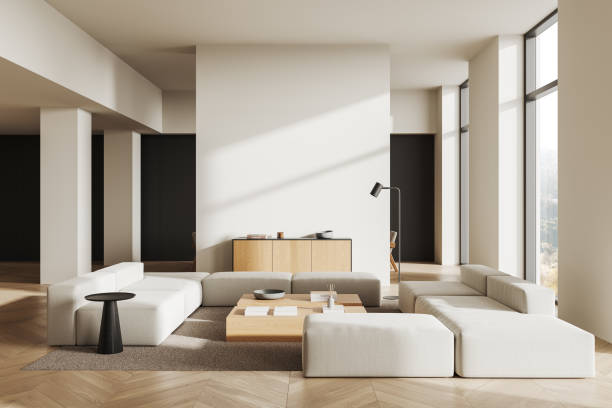 istock Modern minimalist living room with white modular sofa and wooden coffee table in bright interior. 3D Rendering 2196145170