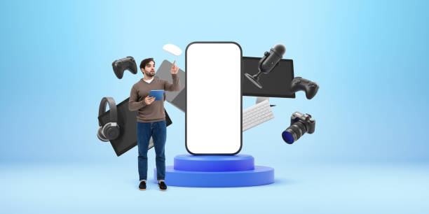 istock Person showing large smartphone mockup with tech gadgets on blue 2196145329