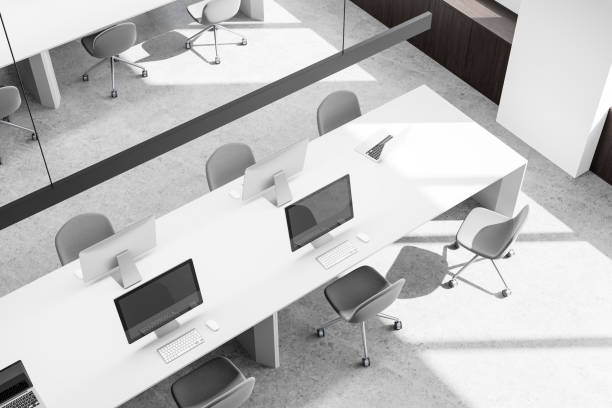 istock Top view of modern open space office interior with white desks and gray chairs in a bright loft-style room. 3D Rendering 2196146149